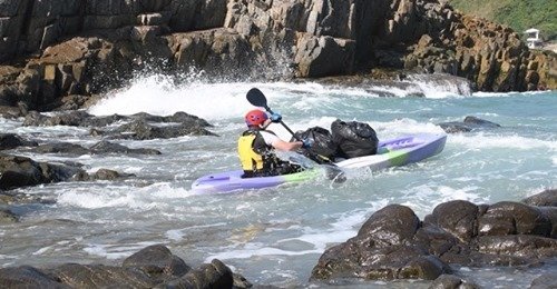 rubbish clean up by kayak